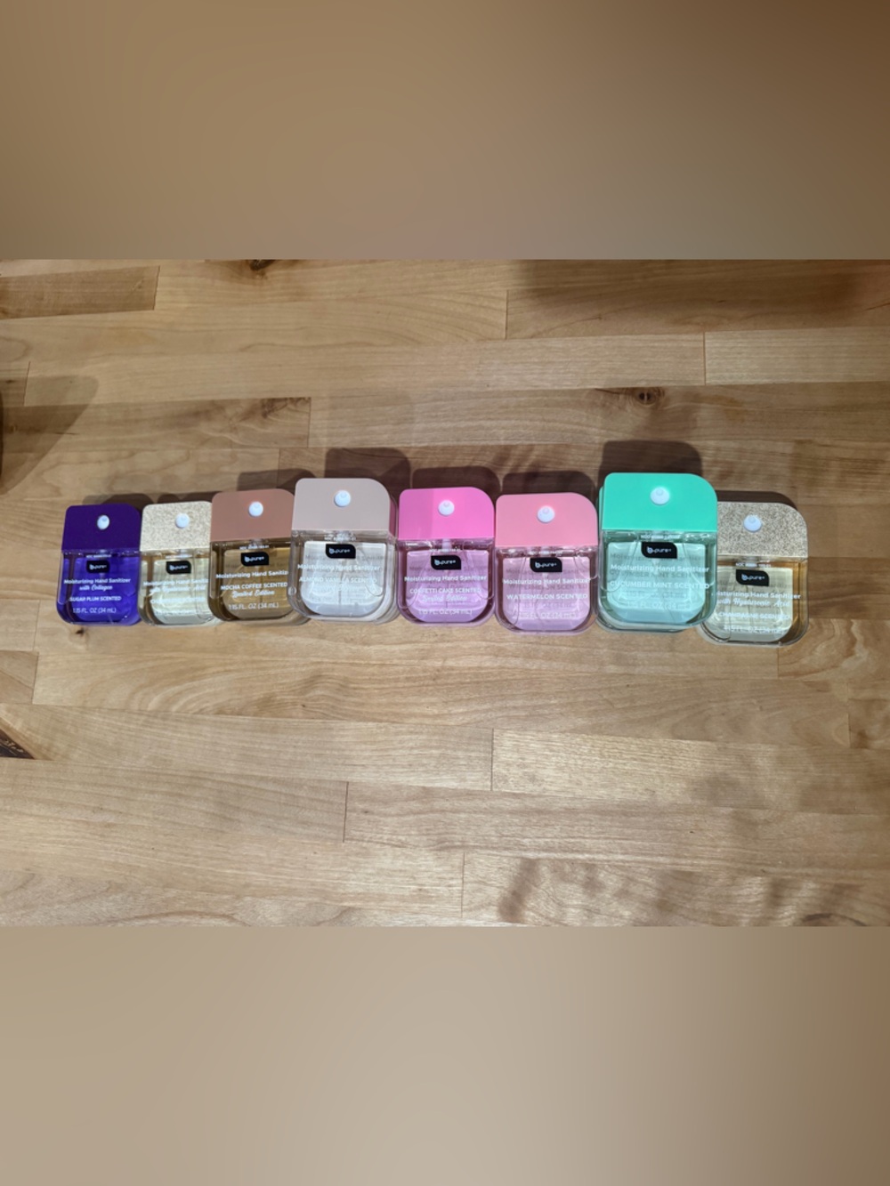 Portable Hand Sanitizer Spray with Mint Green, Pink, Purple & Neutral Color Tops